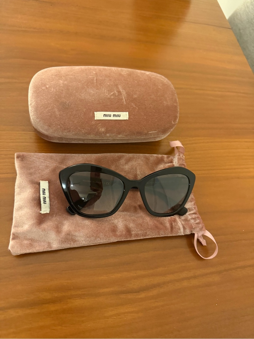 Miu Miu Black Cat-Eye Sunglasses with Pink Velvet Case